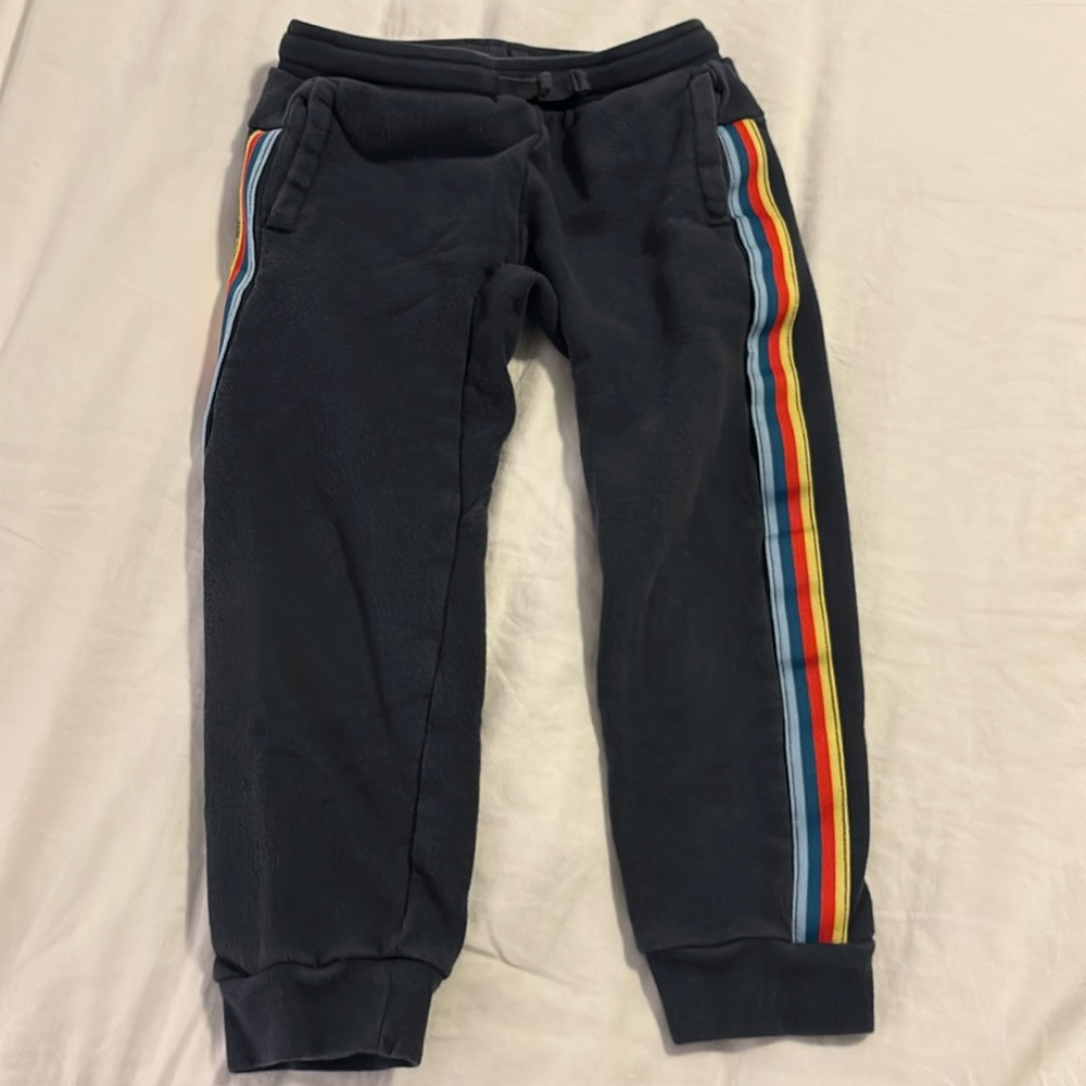 Tea Collection blue jogger sweatpants with multi colored stripe down sides